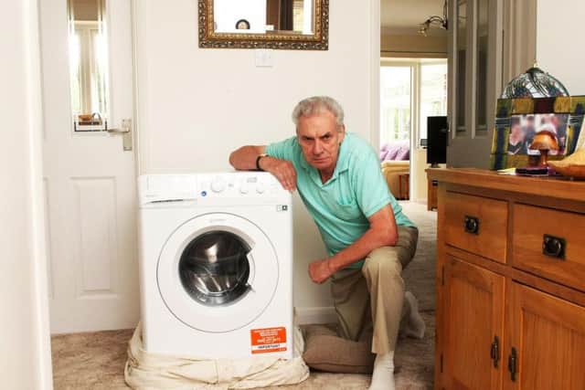 Paul Darnes from Rustington with the faulty washing machine. Picture: Derek Martin
