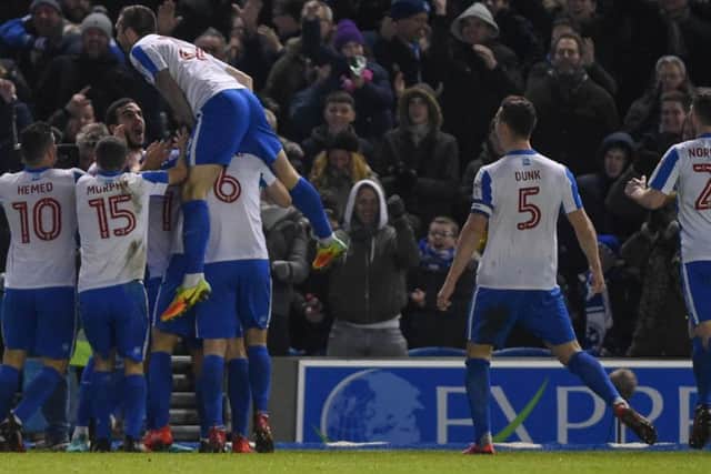 Brighton celebrate Knockaert's opener. Picture by Phil Westlake (PW Sporting Photography).